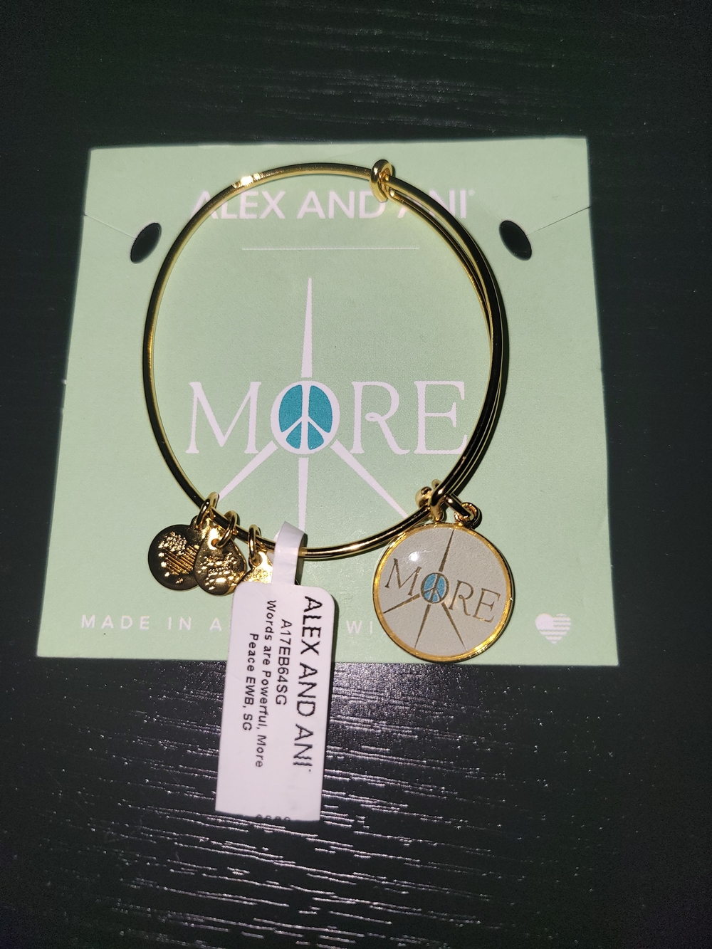 Alex and Ani Gold Bangle with Blue Peace 'MORE' Charm
